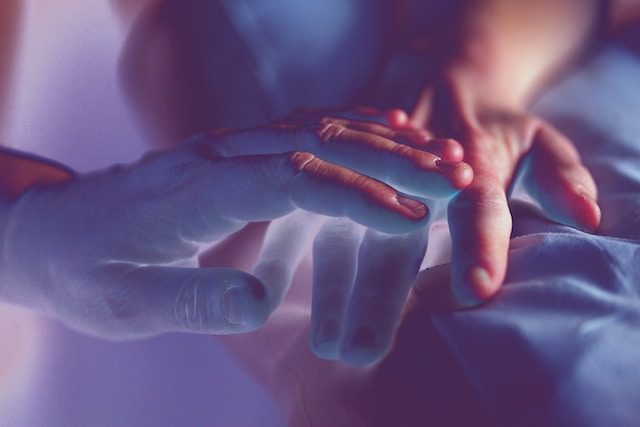 Two hands held together in a gesture of healing, symbolizing protection and relief from the effects of black magic.  showing discission about black magic and the quran